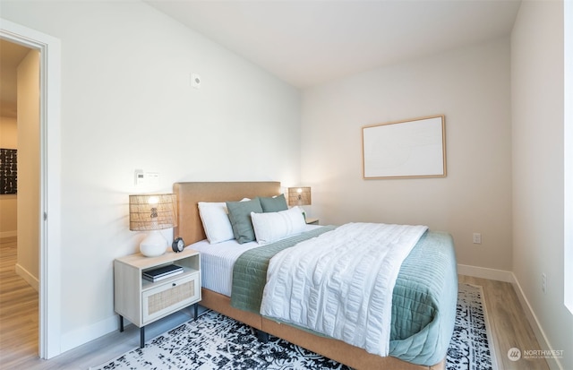 bedroom with light hardwood / wood-style flooring