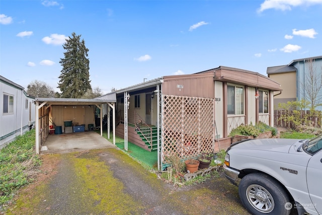 view of front facade with a carport