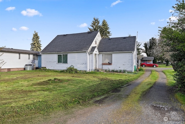 view of side of property featuring a yard