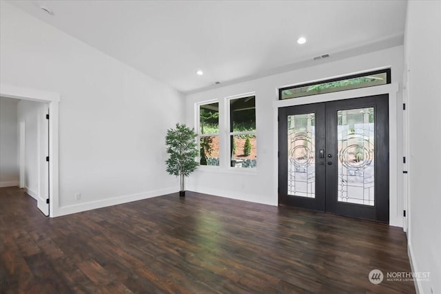 entryway featuring french doors, dark wood-type flooring, and a healthy amount of sunlight