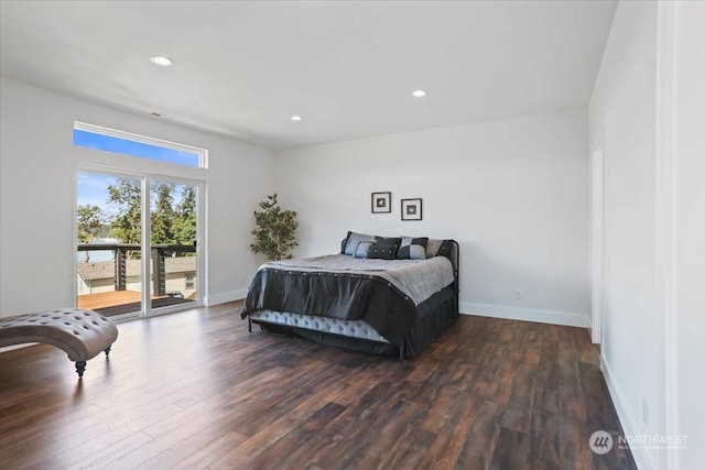 bedroom featuring dark hardwood / wood-style flooring and access to outside