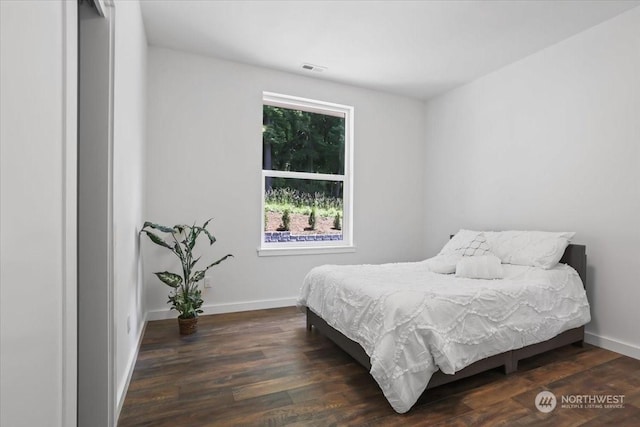 bedroom featuring dark wood-type flooring