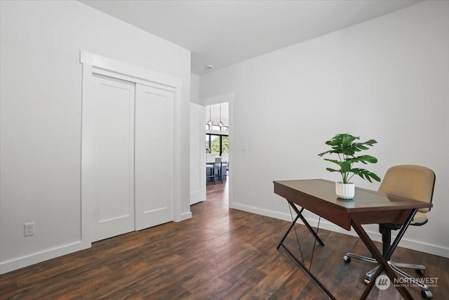 home office with dark hardwood / wood-style flooring