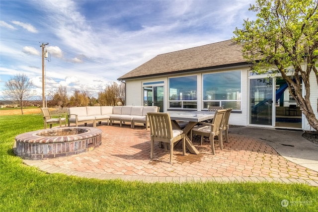 view of patio / terrace featuring an outdoor living space with a fire pit