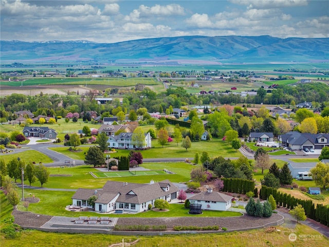 birds eye view of property with a mountain view