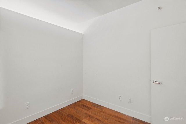 empty room with hardwood / wood-style floors