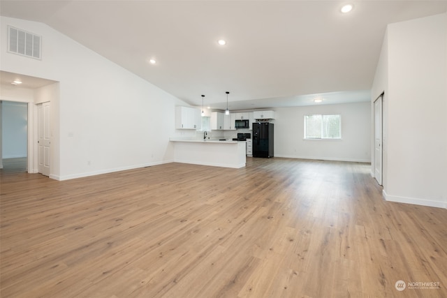 unfurnished living room featuring light wood-style flooring, visible vents, baseboards, and recessed lighting