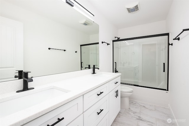 full bathroom featuring combined bath / shower with glass door, tile floors, toilet, and dual vanity