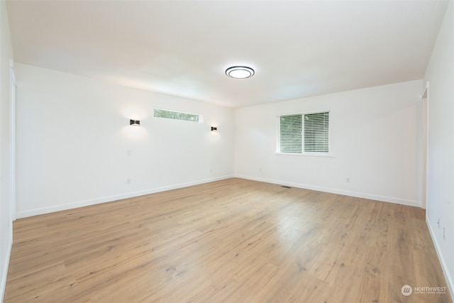 spare room featuring light hardwood / wood-style floors