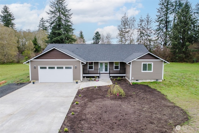 ranch-style home featuring a front lawn, covered porch, and a garage