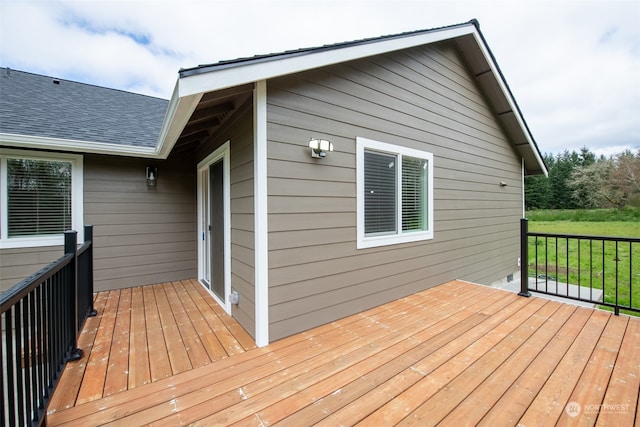 wooden terrace with a yard