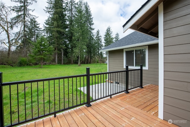 deck featuring a lawn