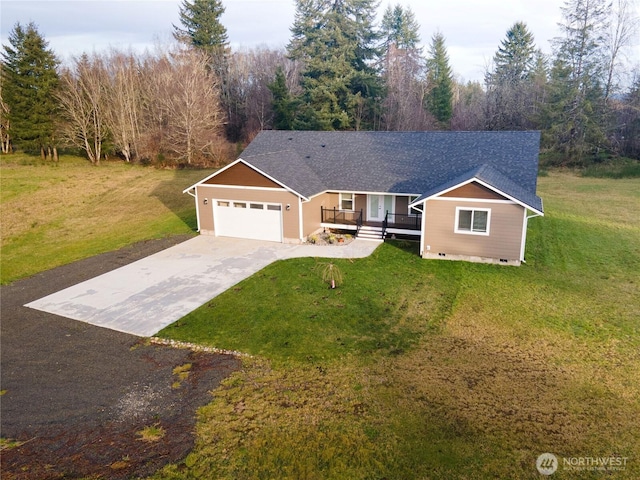 view of front of home with a garage, driveway, crawl space, and a front yard