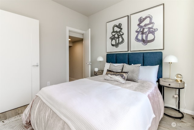 bedroom with light hardwood / wood-style floors