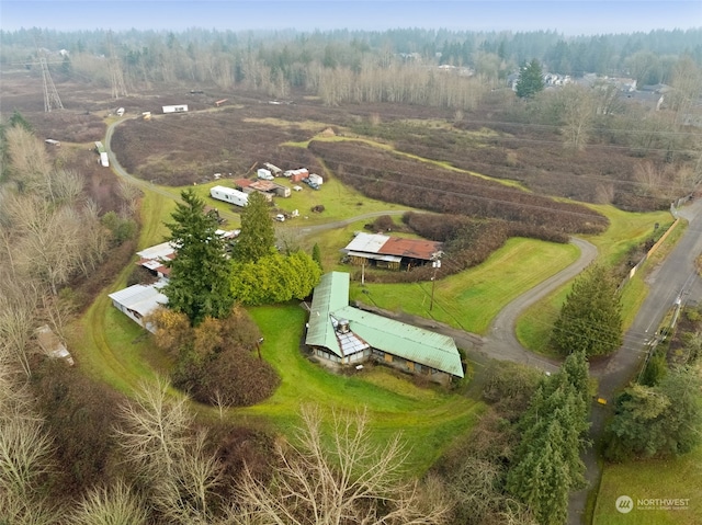 birds eye view of property with a rural view