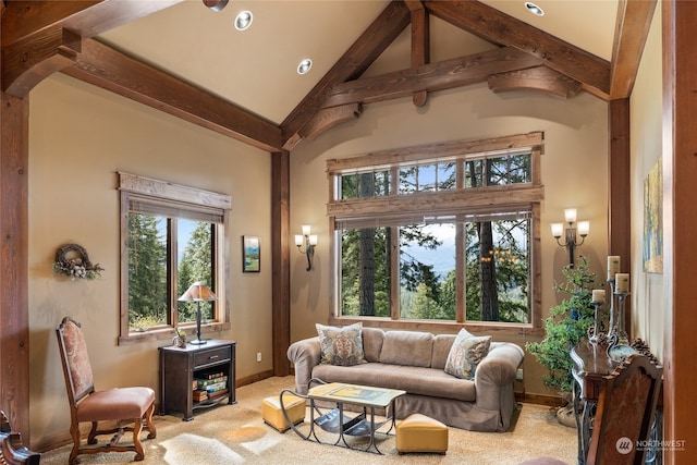 carpeted living room featuring beam ceiling, high vaulted ceiling, and a healthy amount of sunlight