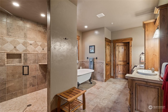 1450 Pinegrass Loop, Cle Elum, WA 98922 - full bathroom featuring a shower stall, a freestanding tub, tile walls, double vanity, and recessed lighting