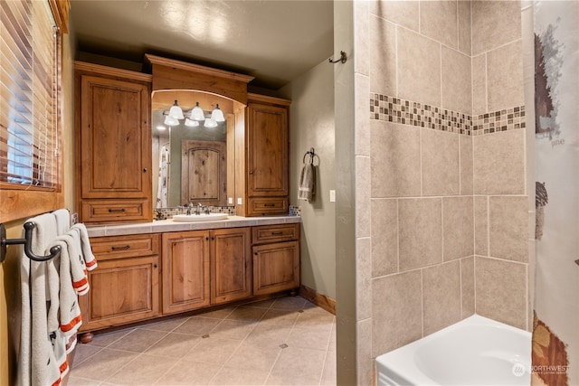 bathroom with tile patterned flooring and vanity