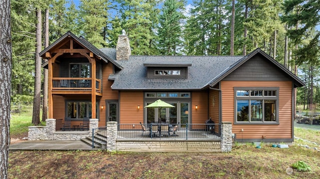 1450 Pinegrass Loop, Cle Elum, WA 98922 - rear view of property featuring a balcony, a patio, a chimney, and a shingled roof