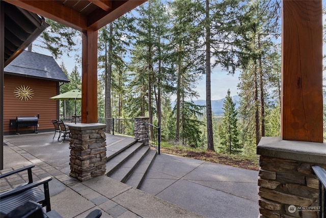 view of patio / terrace featuring a mountain view