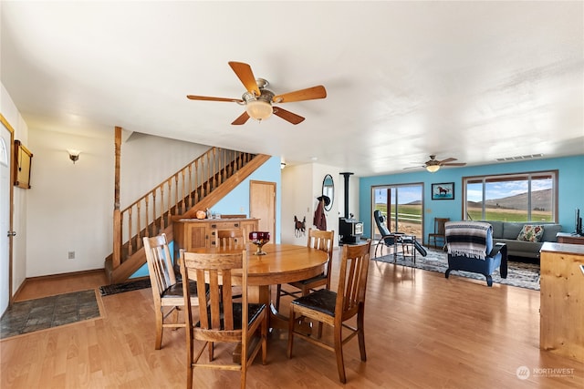 dining room featuring ceiling fan and light hardwood / wood-style floors