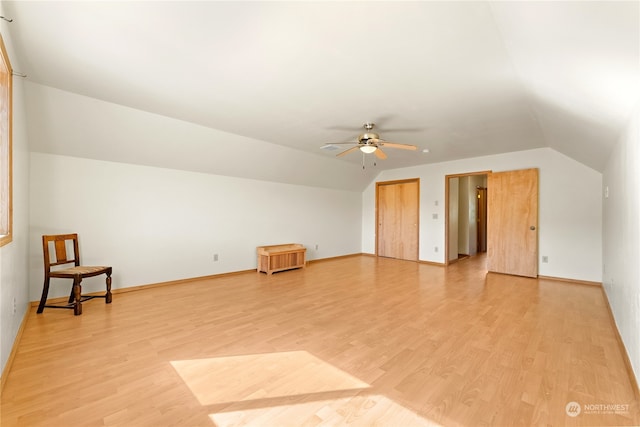 additional living space with light hardwood / wood-style flooring, ceiling fan, and vaulted ceiling