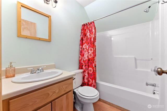 full bathroom featuring wood-type flooring, vanity, shower / bathtub combination with curtain, and toilet