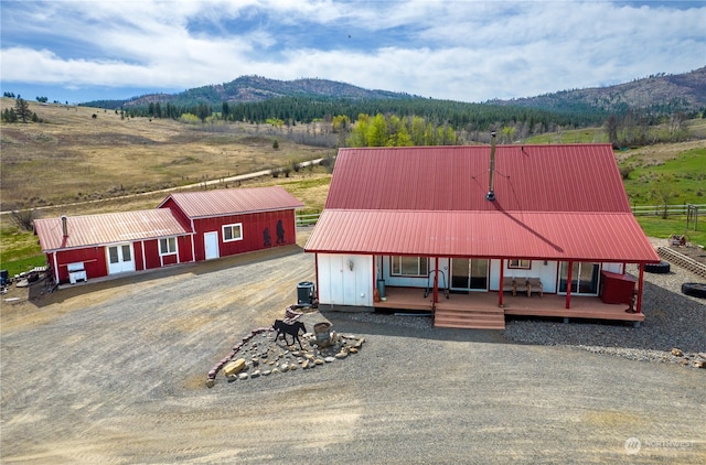 birds eye view of property with a mountain view