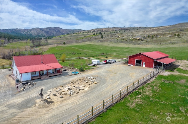 birds eye view of property with a rural view