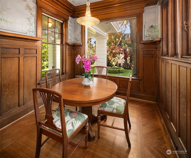 dining area with a wealth of natural light and parquet flooring