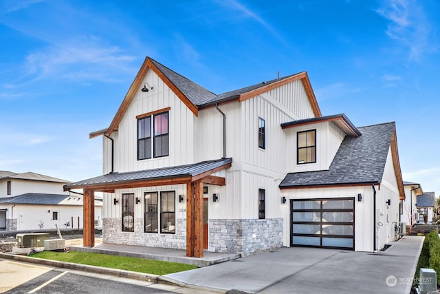 modern farmhouse style home featuring a garage and a porch