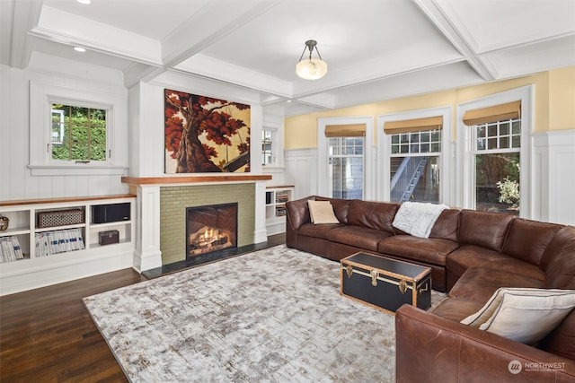 living room with beamed ceiling, coffered ceiling, and dark hardwood / wood-style flooring