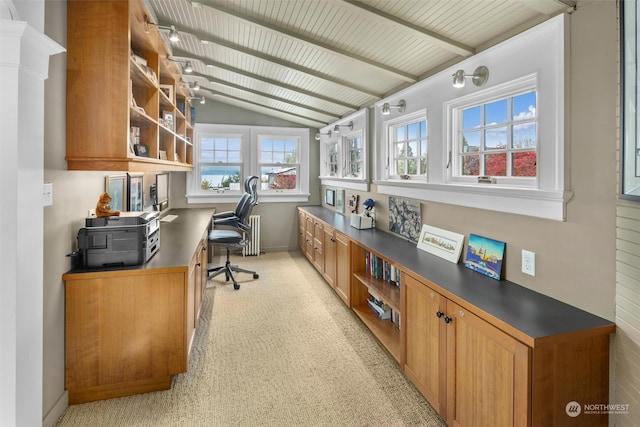 carpeted office space with lofted ceiling