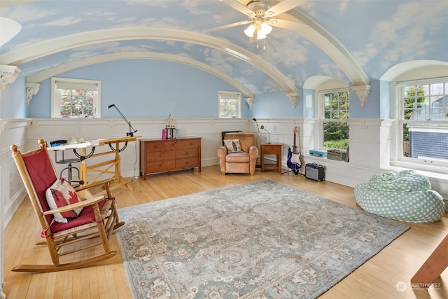 sitting room featuring lofted ceiling, light hardwood / wood-style floors, and ceiling fan