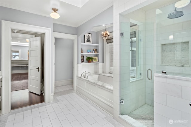 bathroom featuring built in shelves, a chandelier, crown molding, tile patterned floors, and shower with separate bathtub