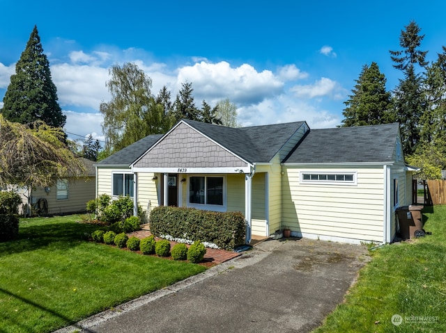 ranch-style home featuring a front yard