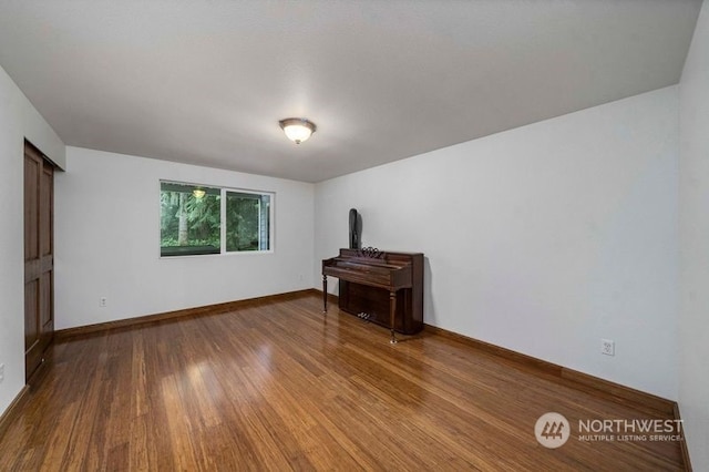 unfurnished room featuring hardwood / wood-style floors