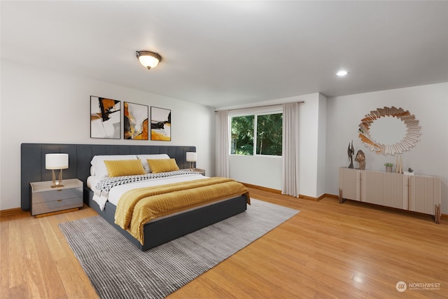 bedroom with light wood-type flooring