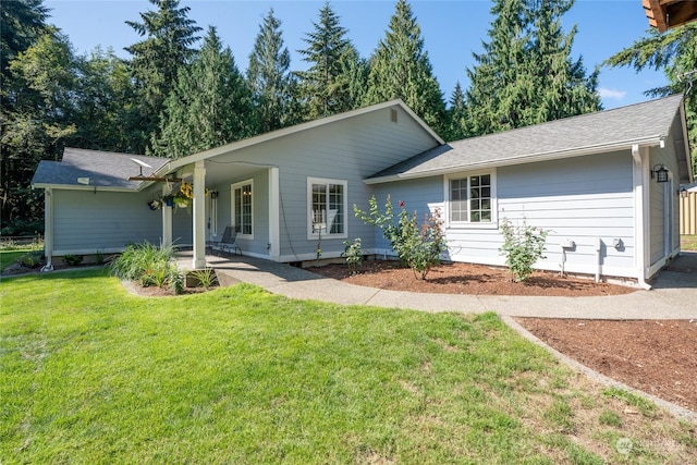 single story home with a front yard and roof with shingles