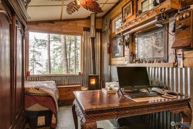 carpeted office space featuring lofted ceiling