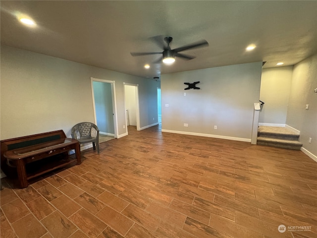 empty room with ceiling fan and hardwood / wood-style flooring