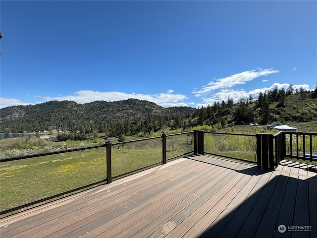 wooden terrace with a mountain view