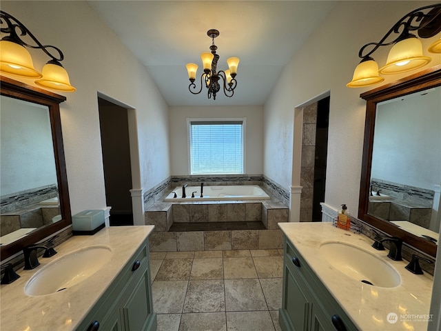 bathroom featuring lofted ceiling, vanity, and a relaxing tiled bath