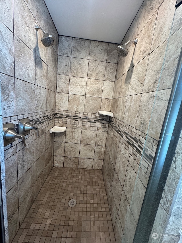 bathroom featuring tiled shower