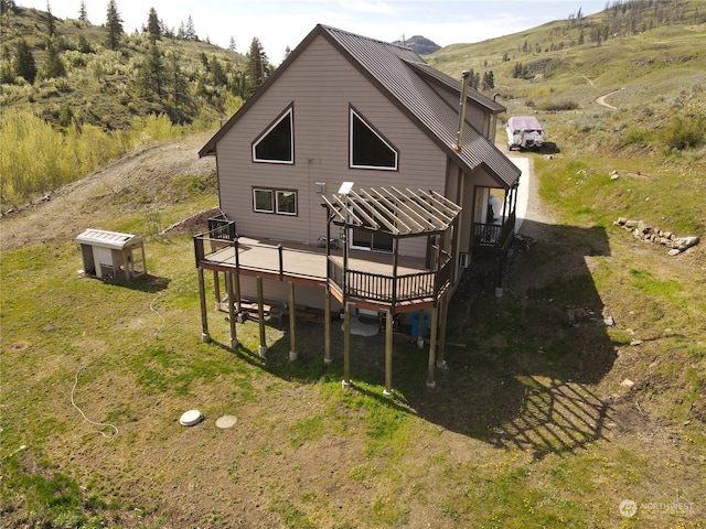 back of house featuring a wooden deck