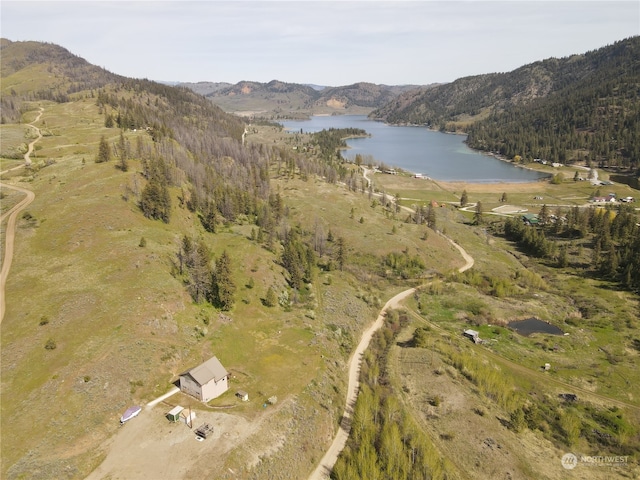 bird's eye view with a water and mountain view