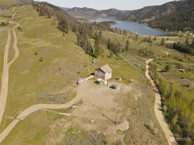 birds eye view of property with a rural view and a water and mountain view