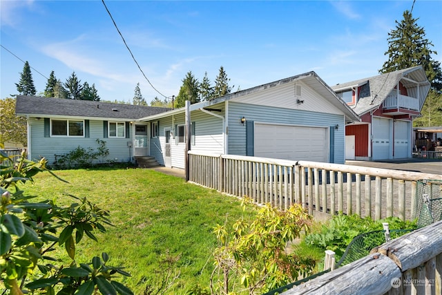 single story home with a garage and a front yard