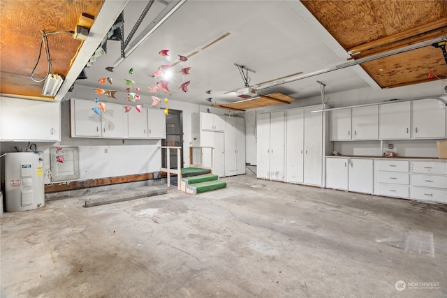 garage featuring a garage door opener and electric water heater