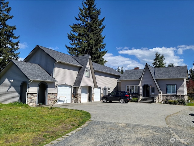 french country home with a garage